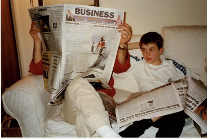 A younger Seán reading the business pages
